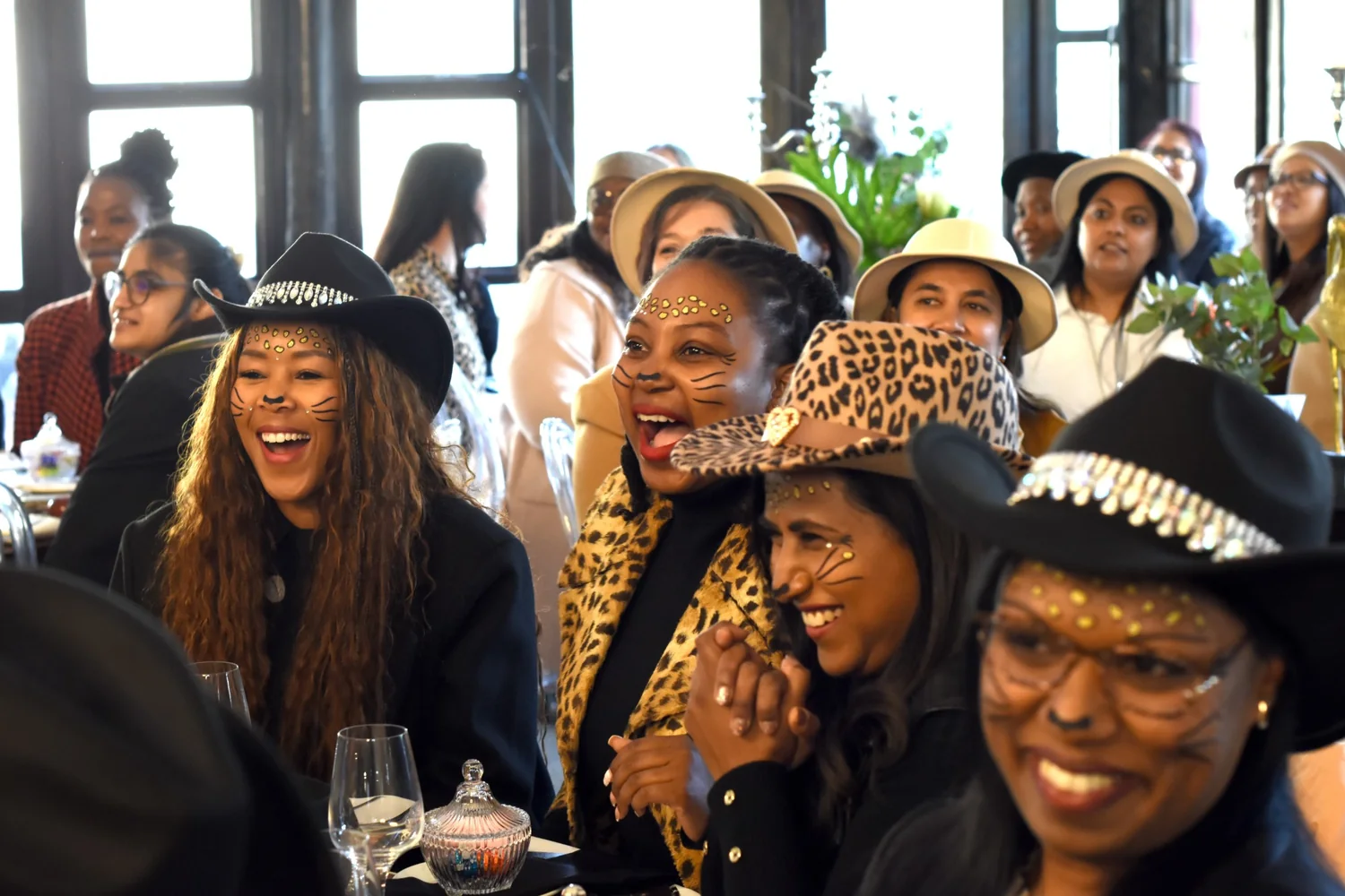 Colleagues laughing together at a Musiekpret year-end function